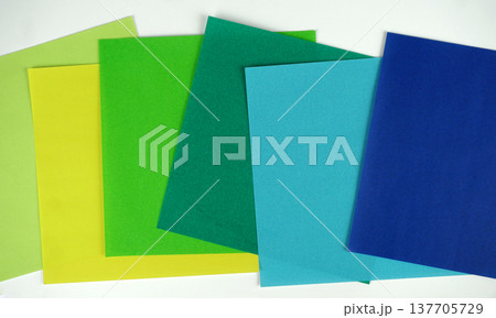 Random composition vibrant colorful square paper geometric with blue and green tone flat lay on white background with copy space 137705729
