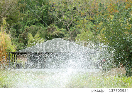 fountain in the city park in the rain fountain in the city park in the rain 137705924
