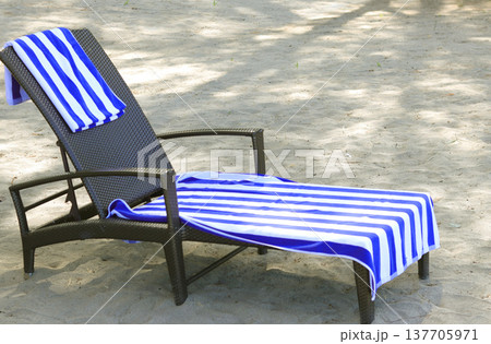 white beach chairs on a sunny day white beach chairs on a sunny day 137705971