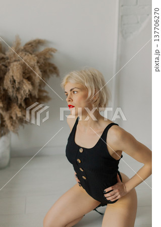 Beautiful woman posing for photographer against Beautiful woman posing for photographer against 137706270