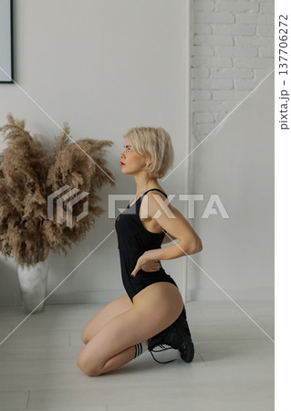 Beautiful woman posing for photographer against Beautiful woman posing for photographer against 137706272