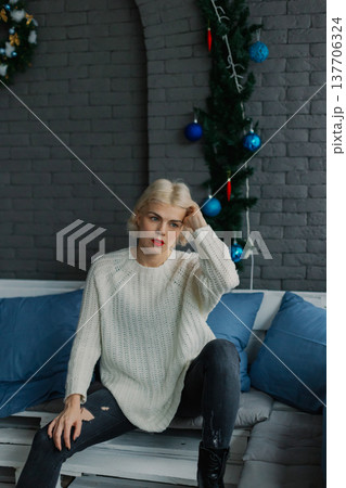 Woman posing for camera in photo studio on wooden Woman posing for camera in photo studio on wooden 137706324