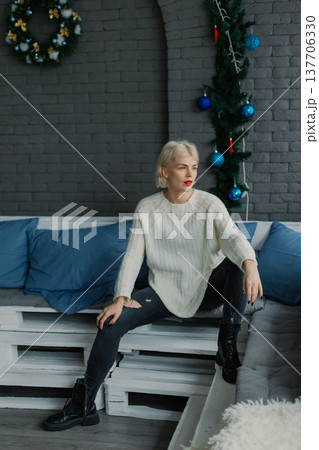 Woman posing for camera in photo studio on wooden Woman posing for camera in photo studio on wooden 137706330