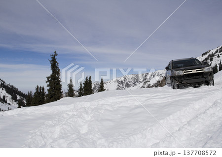 Off-Road SUV Buried in Deep Mountain Snow During Winter Expedition Off-Road SUV Buried in Deep Mountain Snow During Winter Expedition 137708572