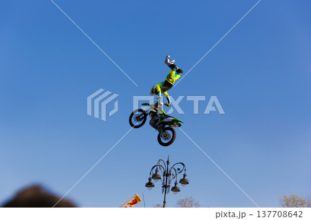 Adrenaline filled motocross jump during freestyle show Adrenaline filled motocross jump during freestyle show 137708642