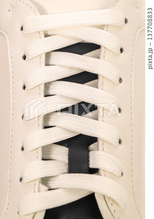 Clean white sneaker detail with black stripe 137708833