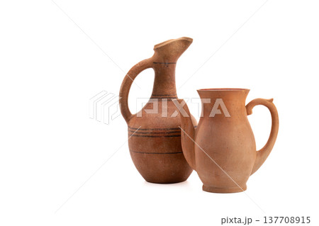 Vintage clay vessels isolated on white Vintage clay vessels isolated on white 137708915
