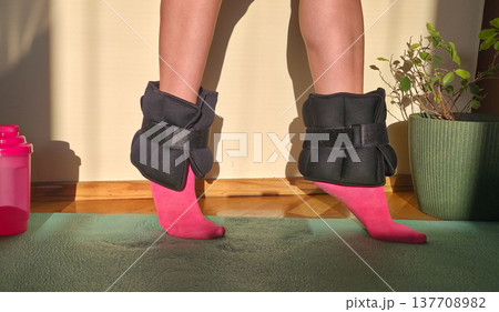 Foot and forearm weights for sports. Exercise weights. Sports accessories. Healthy lifestyle. High quality photo 137708982