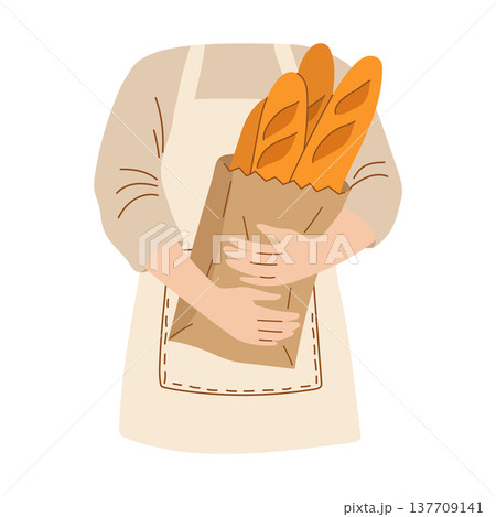 Baker in an apron holding a bag of fresh baguettes 137709141