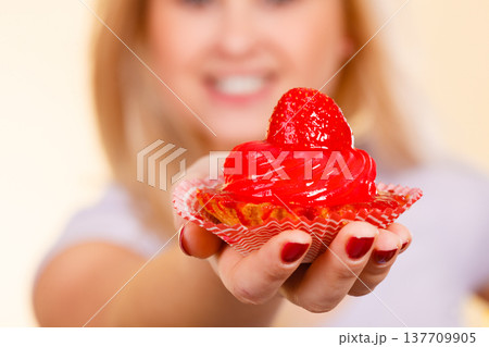 Woman holding sweet delicious cupcake 137709905