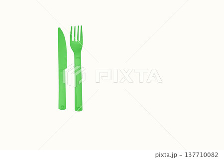 Green plastic knife fork for camping, isolated on white Green plastic knife fork for camping, isolated on white 137710082