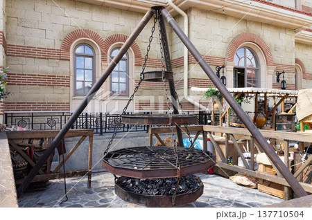 A large metal structure with a grill on top. A large metal structure with a grill on top. 137710504