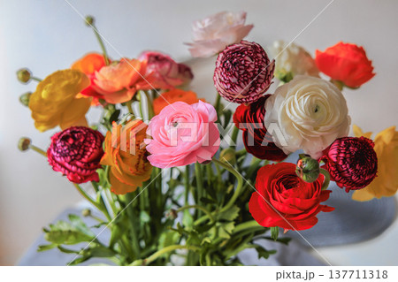 Beautiful ranunculus bouquet with colorful delicate spring flowers. 137711318