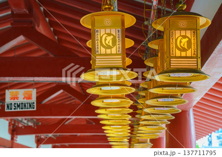 Osaka, Japan - Sep 21 2024, close up view of golden ritual lanterns under roof of a gallery of the Shitenno-ji Buddhist temple, at daytime, Osaka, Japan Osaka, Japan - Sep 21 2024, close up view of golden ritual lanterns under roof of a gallery of the Shitenno-ji Buddhist temple, at daytime, Osaka, Japan 137711795