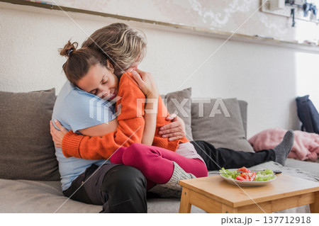 Woman getting comfort from partner dealing with eating disorder 137712918