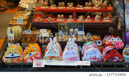 Kyoto, japan - Sep 23 2024, A close-up view of the counter of a souvenir shop with a variety of colorful plush toys of bears, rabbits and cats, without people, Kyoto, Japan 137714909
