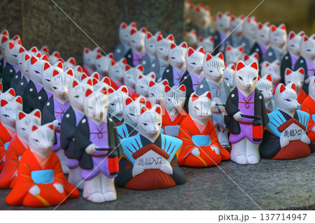 Kyoto, Japan - Sep 23 2024, A close-up view of the many small figures of white kitsune foxes dressed in traditional Japanese costumes at the Fushimi Inari Temple, at daytime, Kyoto, Japan Kyoto, Japan - Sep 23 2024, A close-up view of the many small figures of white kitsune foxes dressed in traditional Japanese costumes at the Fushimi Inari Temple, at daytime, Kyoto, Japan 137714947