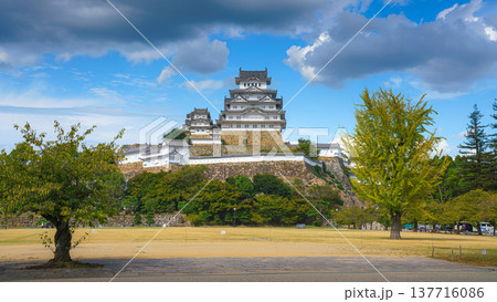 Himeji, Japan - Sep 24 2024, Panoramic view of Sannomaru Square in front of Himeji Castle, White Heron Castle, with a cyclist riding in the foreground, at daytime with cloudy sky, Himeji, Japan 137716086