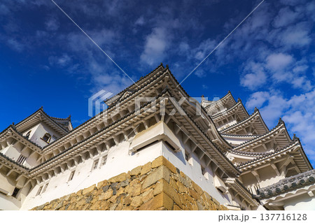 Himeji, Japan - Sep 24 2024, panoramic view of Himeji Castle, White Heron Castle from below, at daytime with blue sky and clouds, without people, Himeji, Japan Himeji, Japan - Sep 24 2024, panoramic view of Himeji Castle, White Heron Castle from below, at daytime with blue sky and clouds, without people, Himeji, Japan 137716128