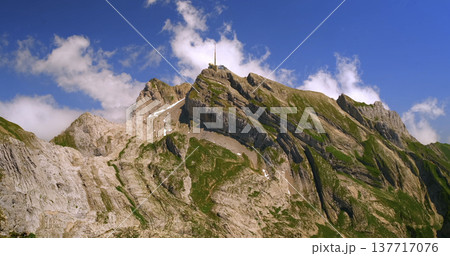 Mountain peak with rocks and green slopes under blue sky during daylight hours Mountain peak with rocks and green slopes under blue sky during daylight hours 137717076