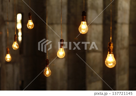 Old model Glow bulbs hanging in the dark at night Old model Glow bulbs hanging in the dark at night 137721145