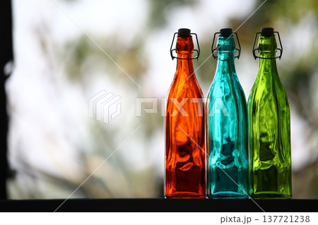 Empty Color Glass Bottle on the table 137721238
