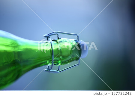 Empty Color Glass Bottle on the table Empty Color Glass Bottle on the table 137721242