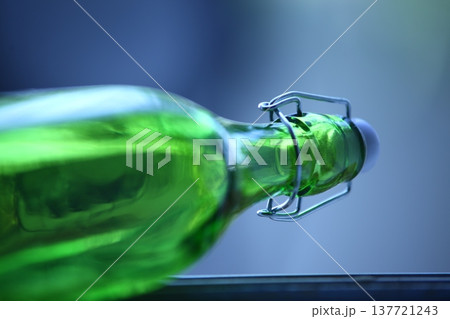 Empty Color Glass Bottle on the table 137721243