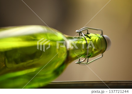 Empty Color Glass Bottle on the table 137721244