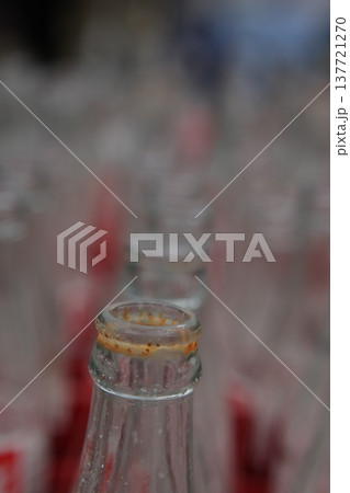 Empty Color Glass Bottle on the table 137721270