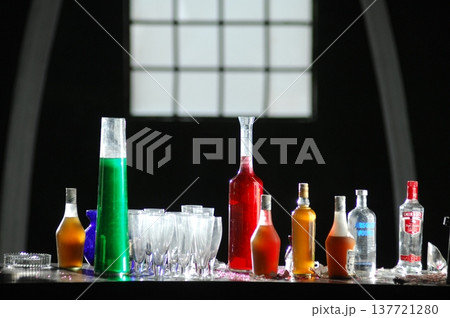 Empty Color Glass Bottle on the table 137721280