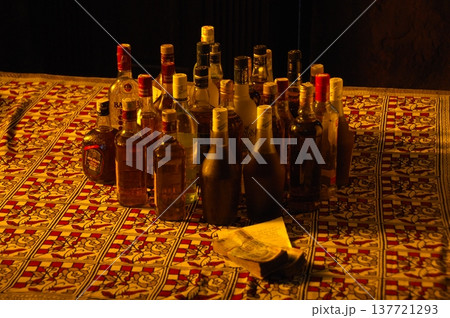 Empty Color Glass Bottle on the table Empty Color Glass Bottle on the table 137721293