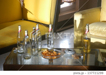 Empty Color Glass Bottle on the table Empty Color Glass Bottle on the table 137721299