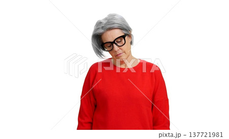 Mature woman wearing glasses feeling tired or sleeping Mature woman wearing glasses feeling tired or sleeping 137721981