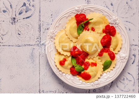 Ravioli with tomato sauce and basil Ravioli with tomato sauce and basil 137722460