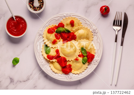 Ravioli with tomato sauce and basil Ravioli with tomato sauce and basil 137722462