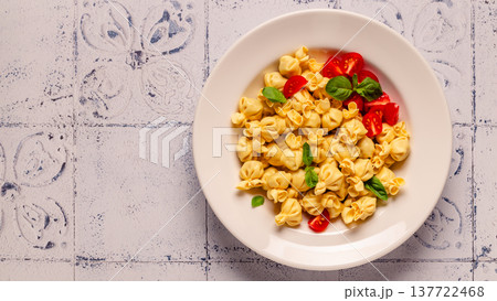 pasta in a plate with tomato sauce. pasta in a plate with tomato sauce. 137722468