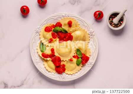 Ravioli with tomato sauce and basil Ravioli with tomato sauce and basil 137722500