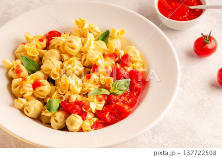 pasta in a plate with tomato sauce. pasta in a plate with tomato sauce. 137722508