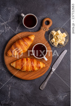 French croissant. Freshly baked croissants with butter coffee 137722663