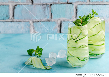 Fresh infused cucumber water on a light blue background 137722678