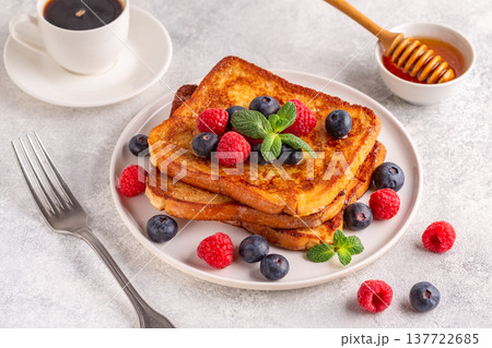 French toast with blueberries, raspberries, maple syrup 137722685
