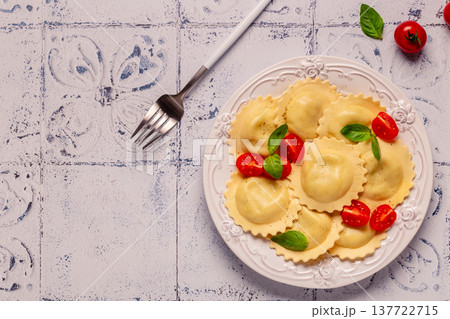 Ravioli with tomato sauce and basil Ravioli with tomato sauce and basil 137722715