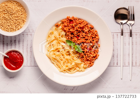 Vegan Bolognese Pasta with plant based minced meat. Vegan Bolognese Pasta with plant based minced meat. 137722733