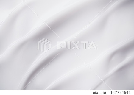 Smooth white cream texture forming elegant flowing waves and swirls 137724646
