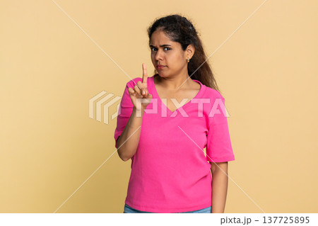 Indian woman shaking finger and head disapprovingly, showing clear no warning to camera 137725895