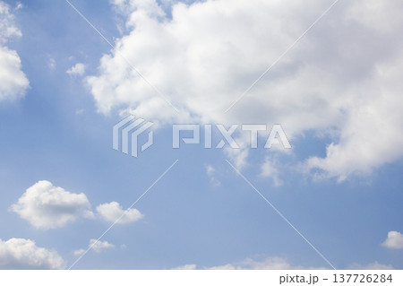 Blue sky with puffy clouds Blue sky with puffy clouds 137726284