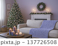 A knitted throw with a floral pattern on a sofa in a bright living room. AI 137726508