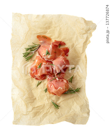 Prosciutto slices with rosemary wrapped in paper. Prosciutto slices with rosemary wrapped in paper. 137726874