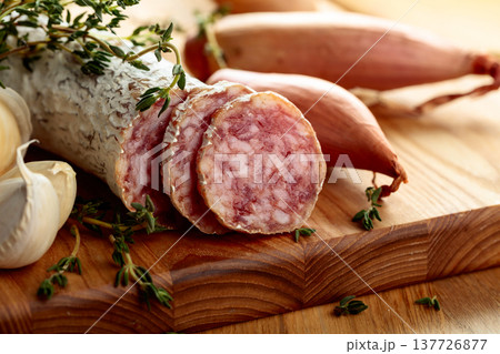 Dry-cured sausage with thyme, garlic, and onion. 137726877